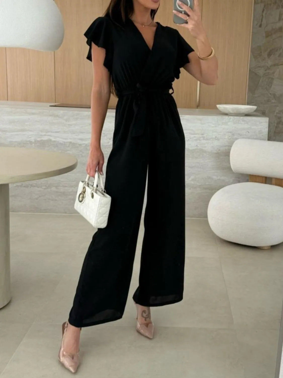 Black tied ruffled wide-leg jumpsuit with V-neck and flutter short sleeves