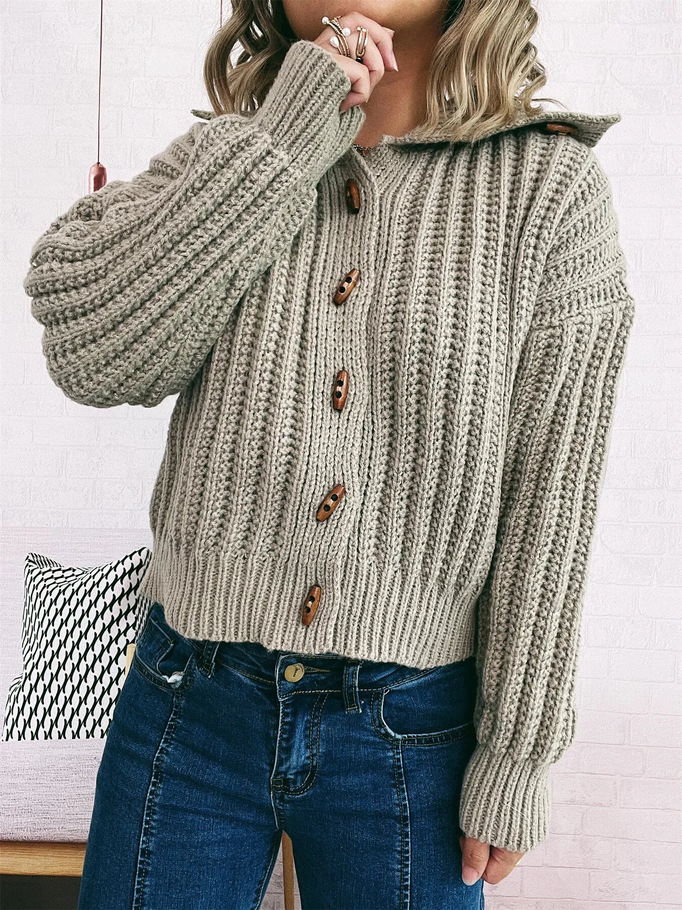 Khaki button-up long-sleeve cardigan with ribbed knit, brown buttons, side view