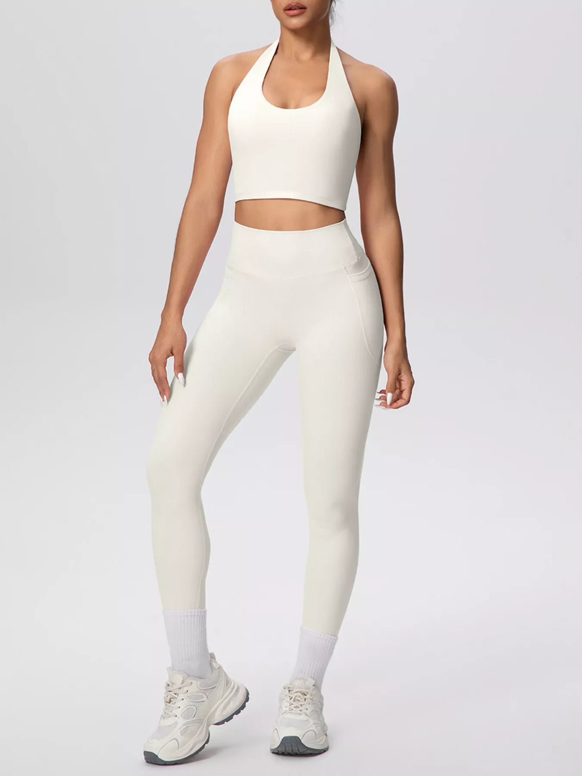 Cream halter crop top and high-waist pocketed leggings set with contrast ankle cuffs