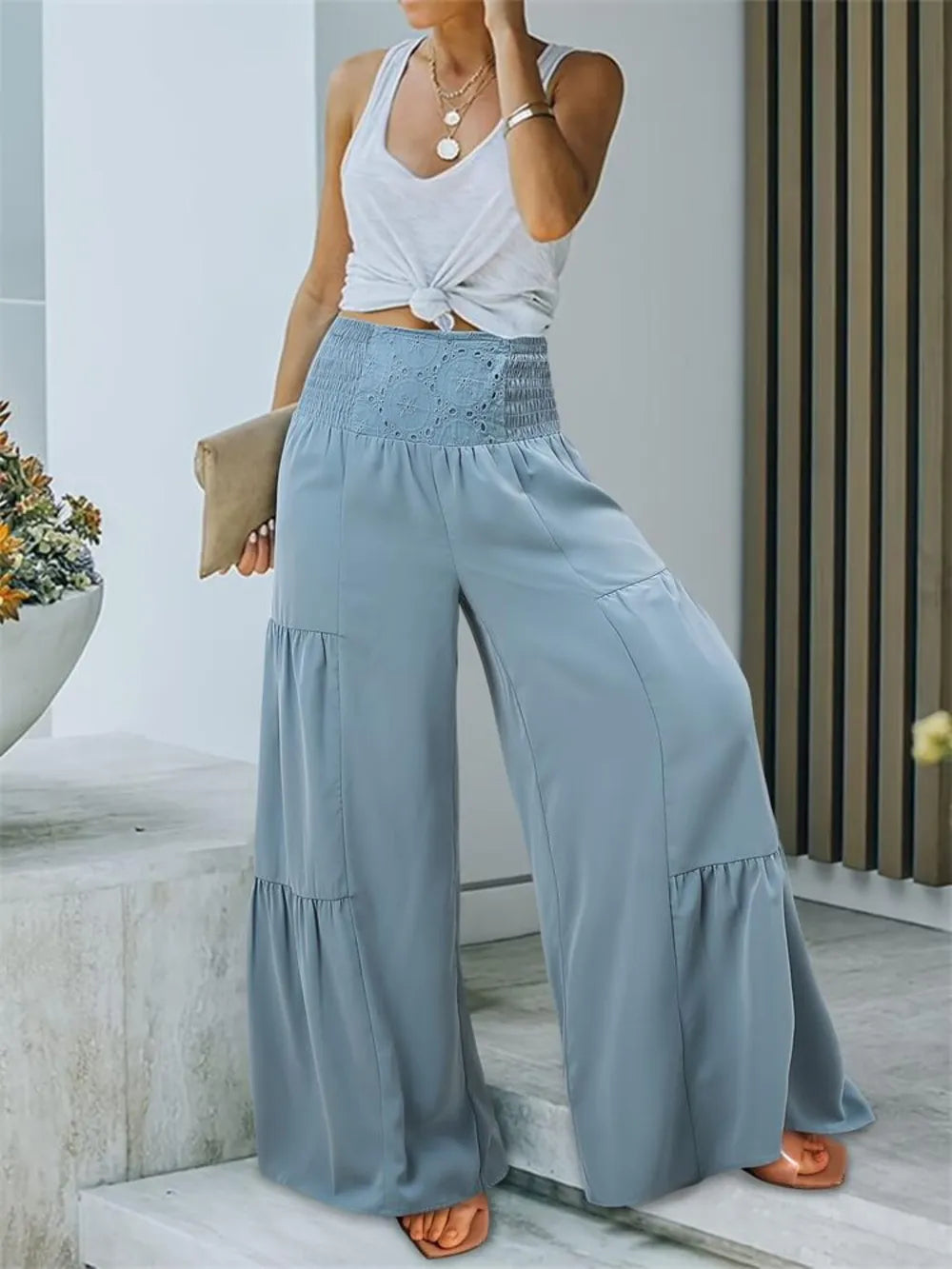 Light blue smocked high-waist wide-leg pants with tiered hem