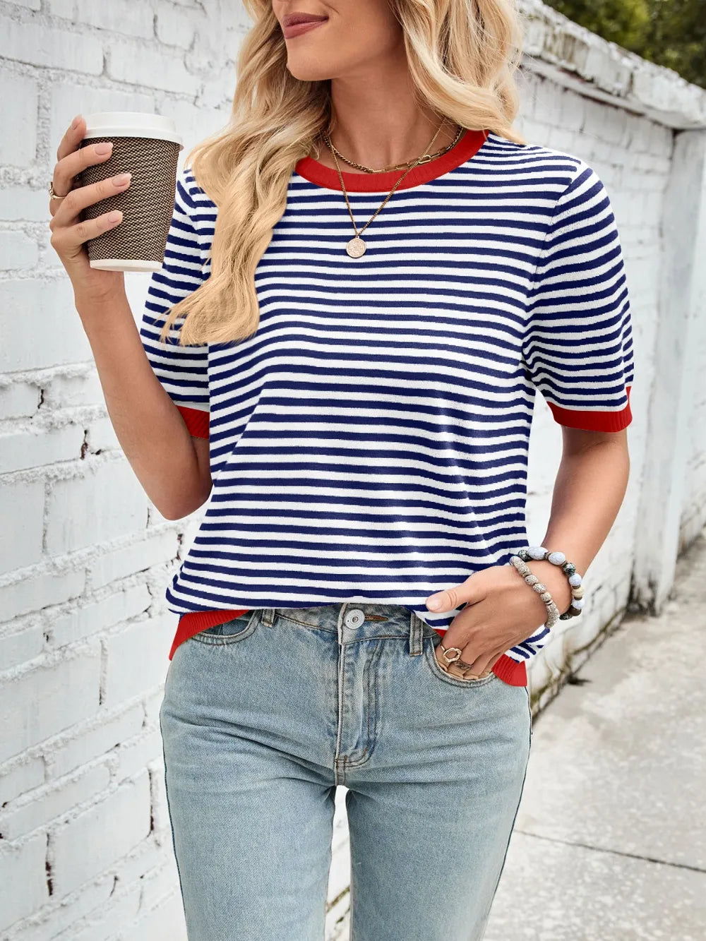 Navy and white striped knit top with red contrast round neck and ribbed hem trim