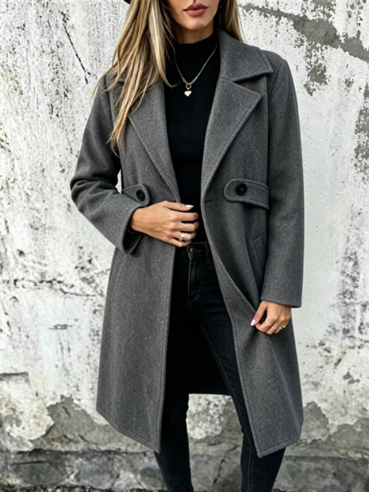 Dark gray longline button-lapel coat with flap pockets and front buttons