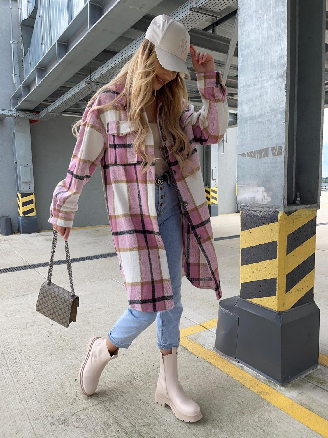 Plaid longline collared shirt in pink and cream with black grid, chest pockets, button-front