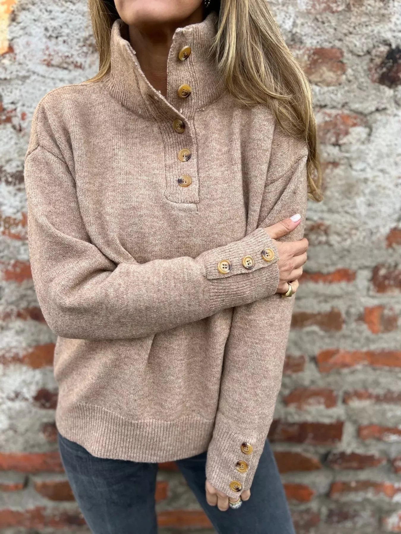Khaki turtleneck button sweater with long sleeves and gold-tone cuff button trim