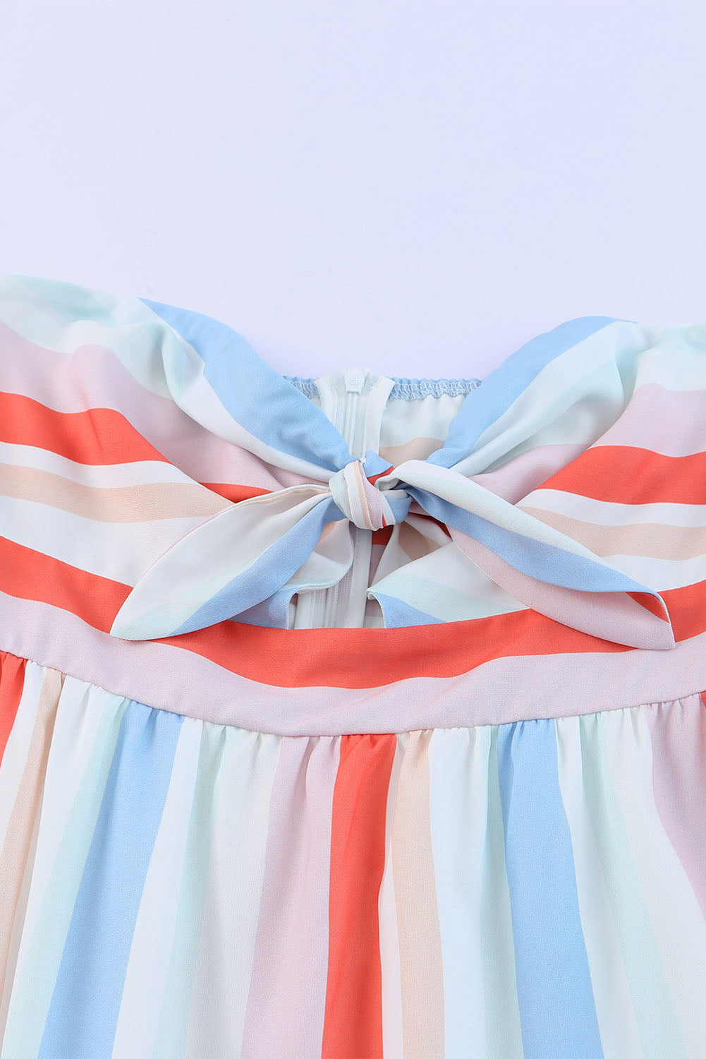 Striped strapless sweetheart neckline with tied bow and smocked bodice