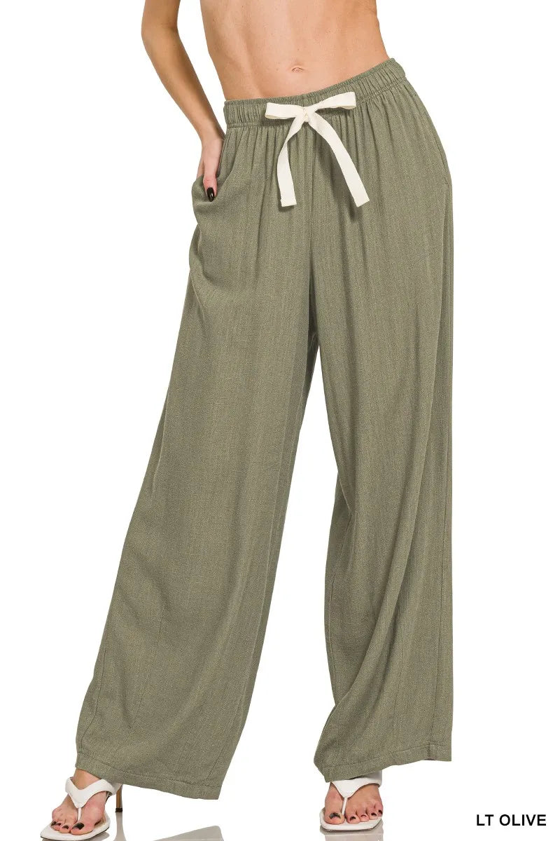 Linen drawstring pants in light olive, elastic waist with tie bow, wide-leg fit