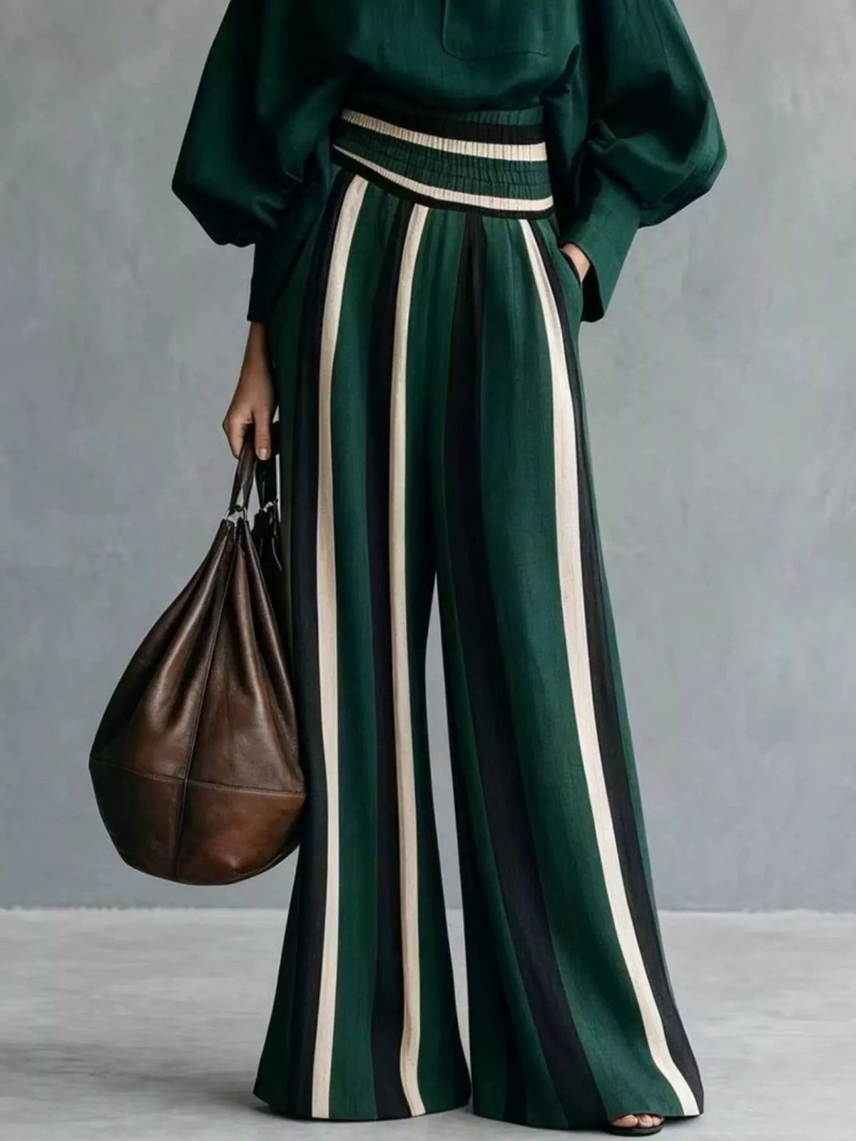 Dark green mock neck long-sleeve top with vertically striped wide-leg pants, ribbed waist