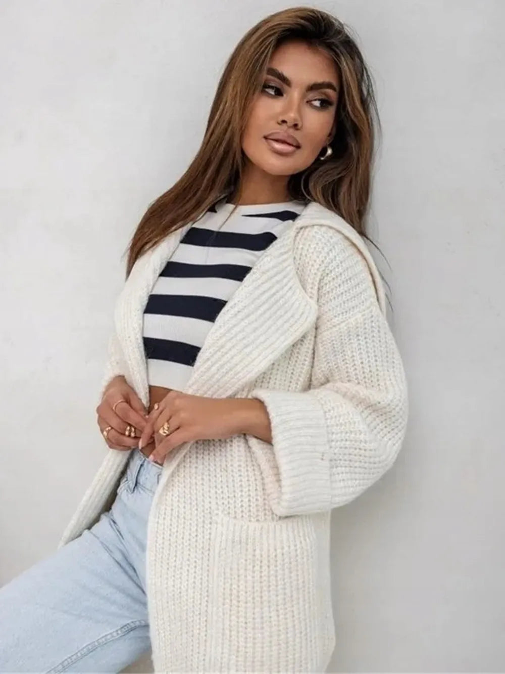 Cream knit cardigan with collared neck and dropped shoulders, open front style