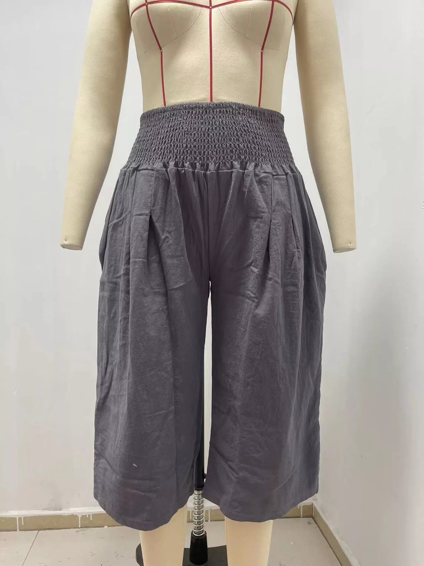 Smocked wide-leg capri pants in dark gray, gathered elastic waist and roomy legs