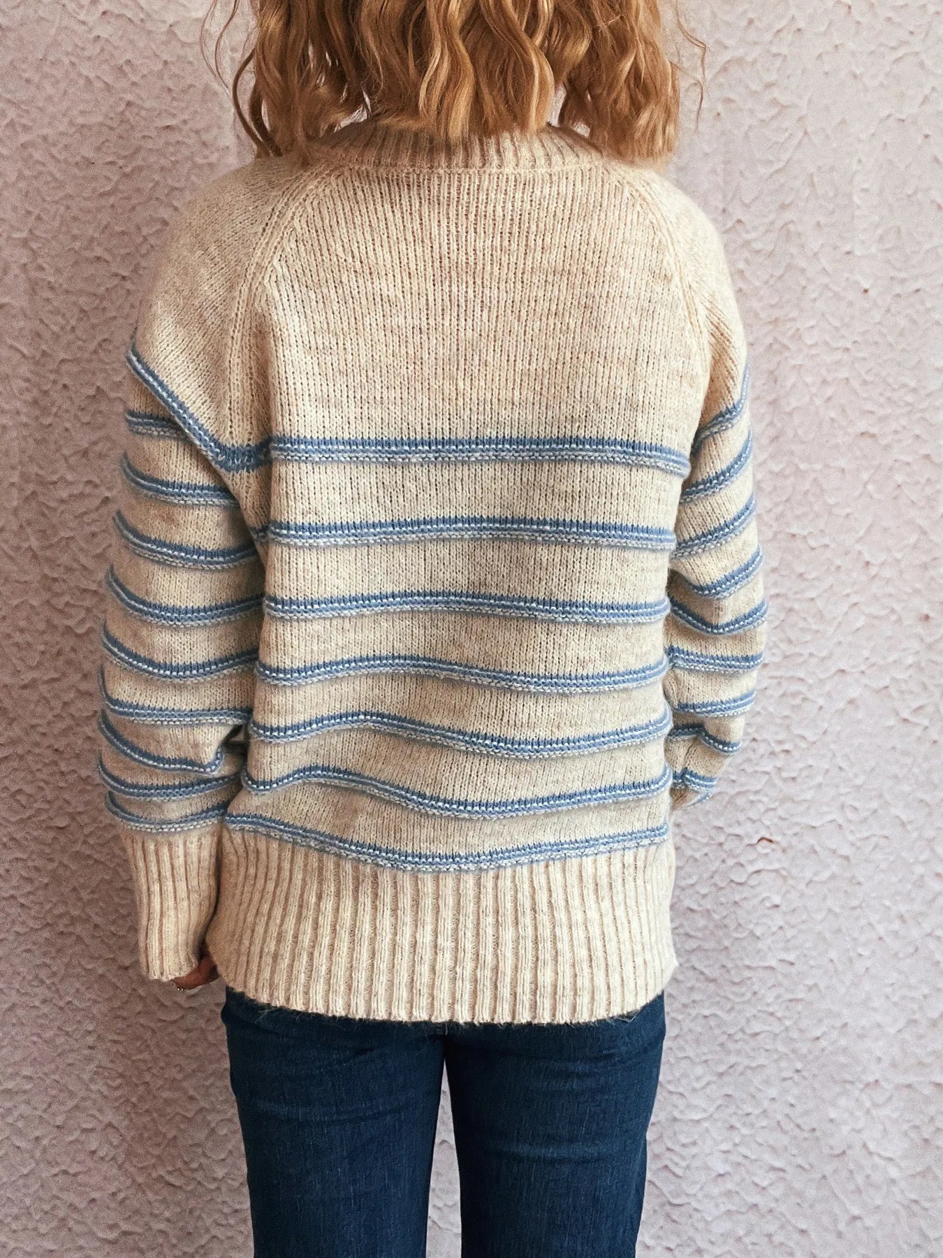 Cream striped long sleeve sweater, ribbed knit back with blue horizontal stripe bands