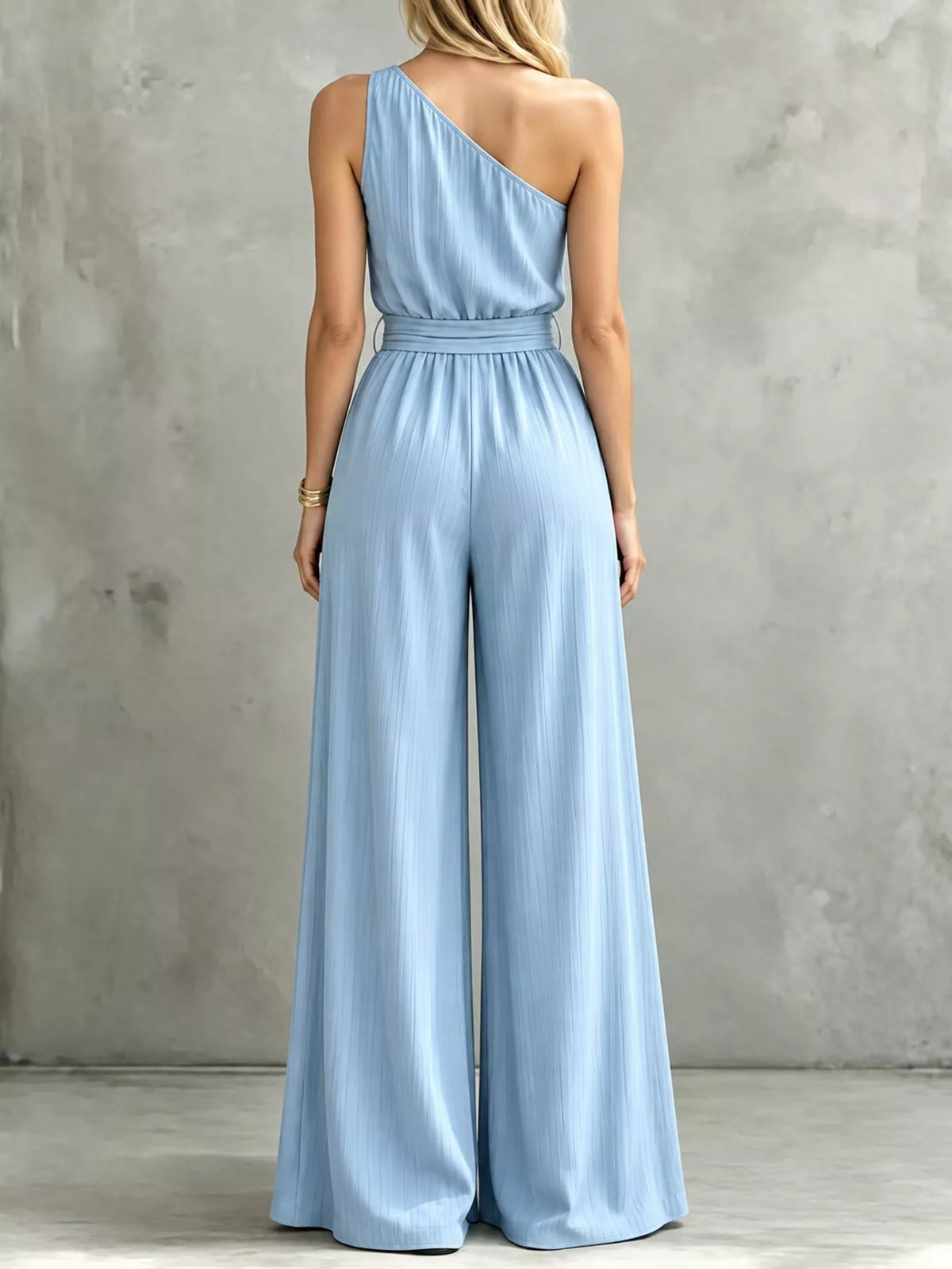 Light blue one-shoulder wide-leg jumpsuit, back view with tied waist