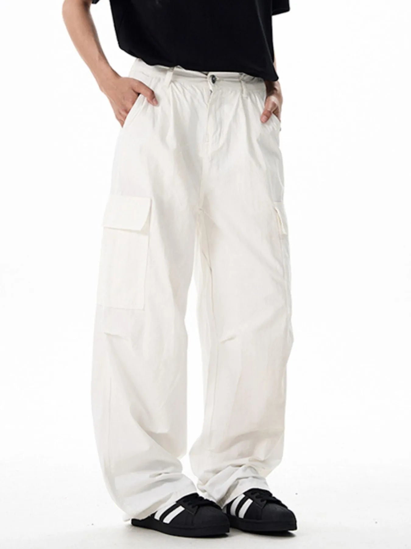 White wide-leg cargo pants with flap cargo pockets and relaxed fit