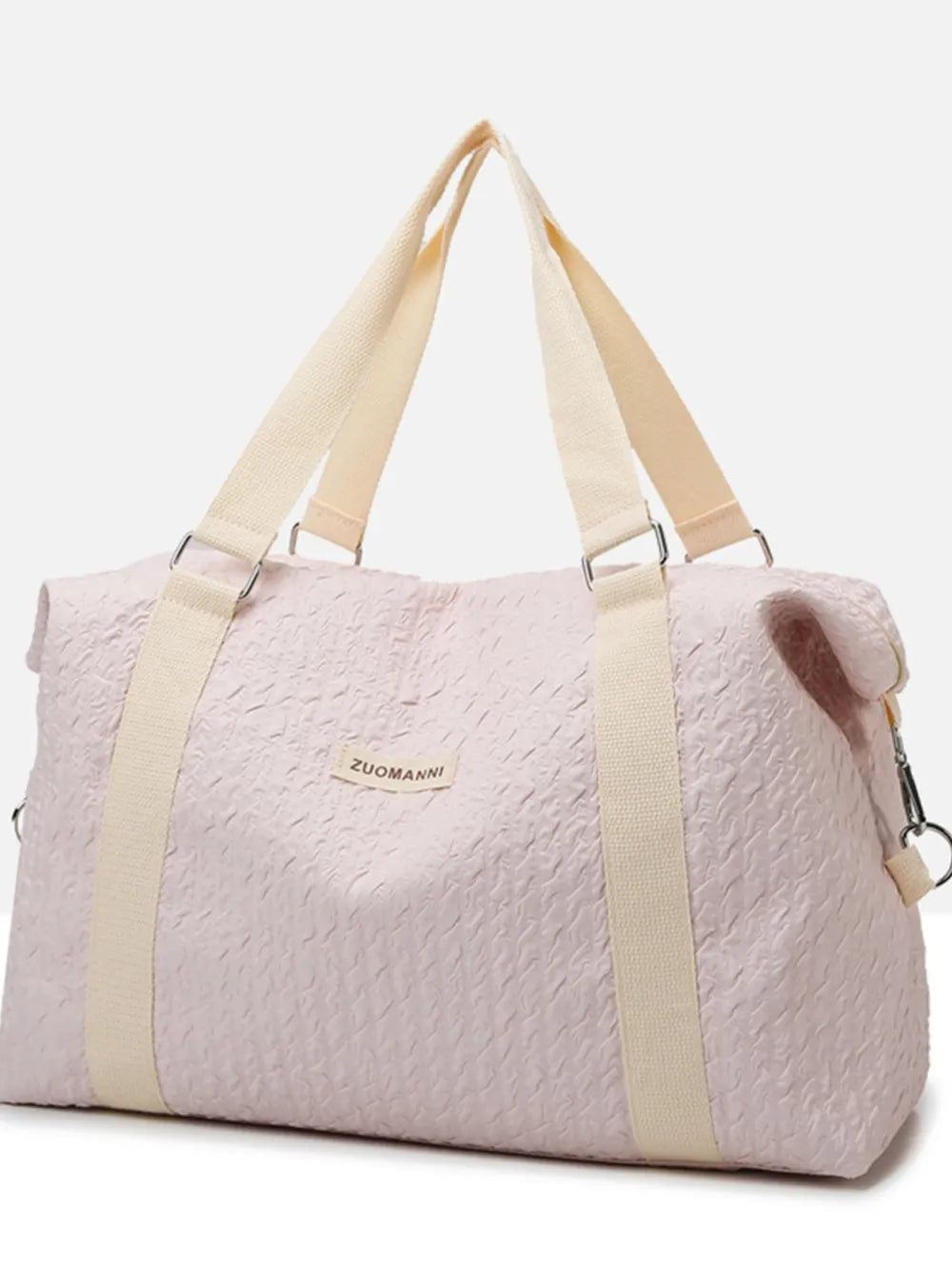 Light pink textured duffle travel bag with tan stripe straps and side zipper