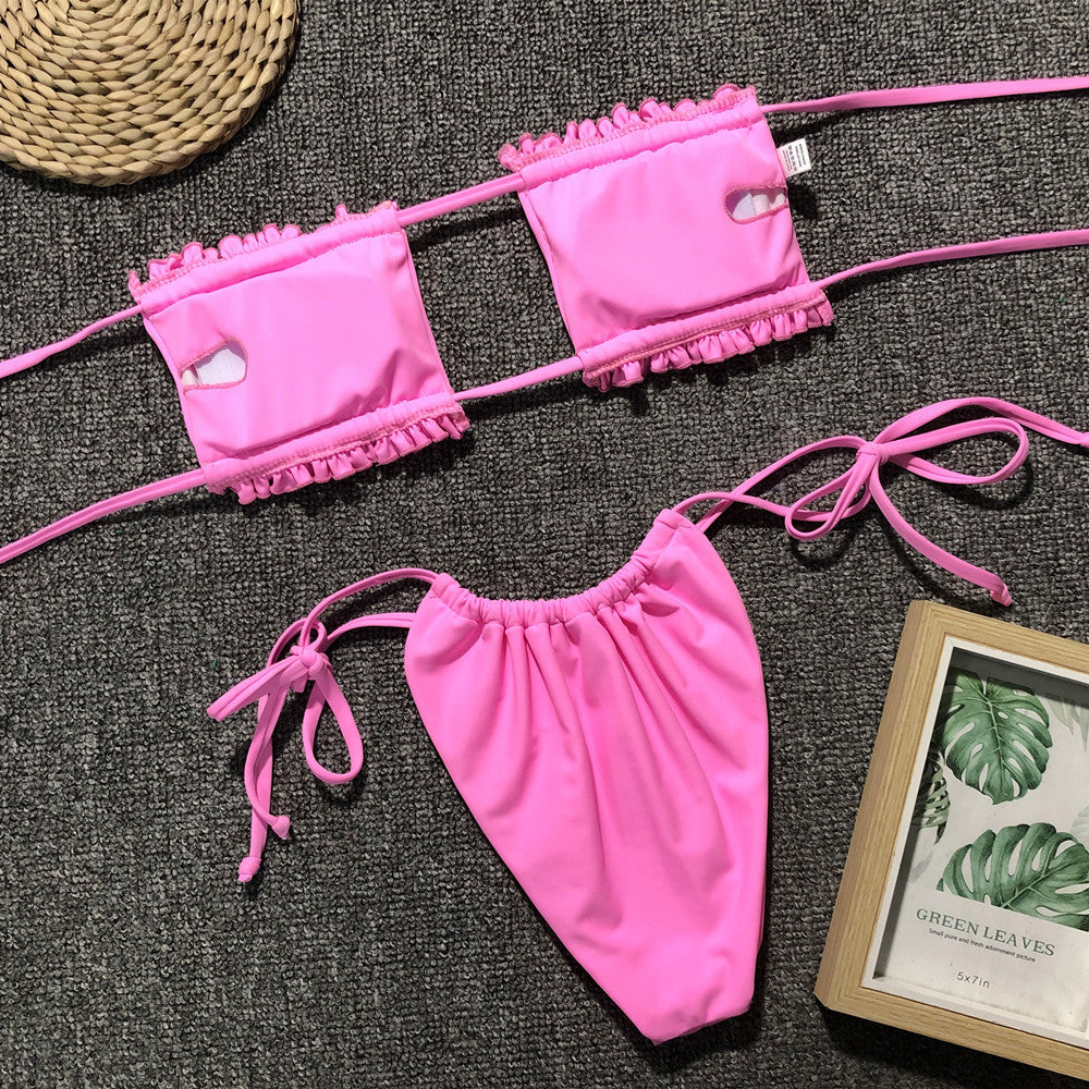 Pink ruched bandeau bikini top with frill trim and matching tie-side bikini bottoms