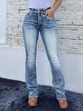 High-waist bootcut jeans in light blue wash with button fly and belt loops