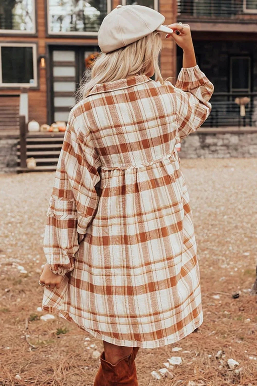 Back view of plaid collared mini shirt dress with long sleeves and tiered skirt