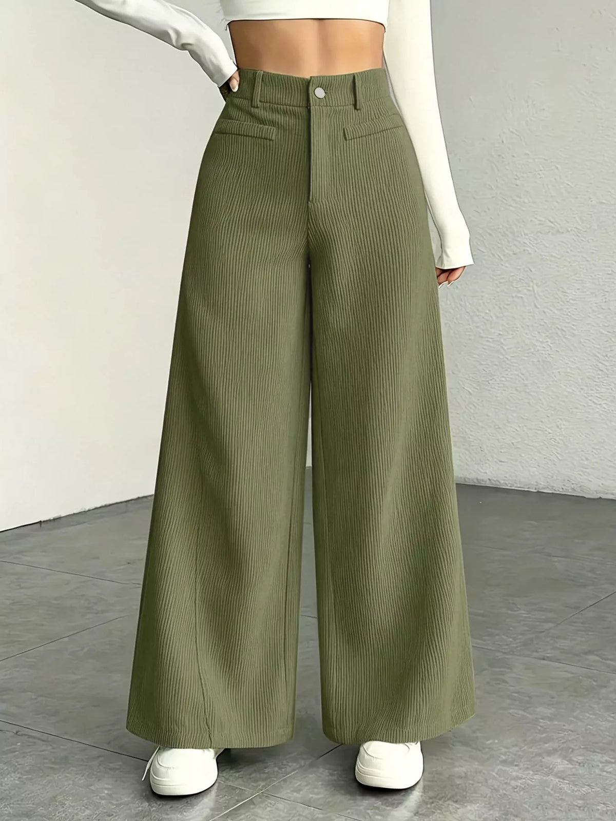 High-waisted wide-leg pants in olive green with front pockets and button closure.