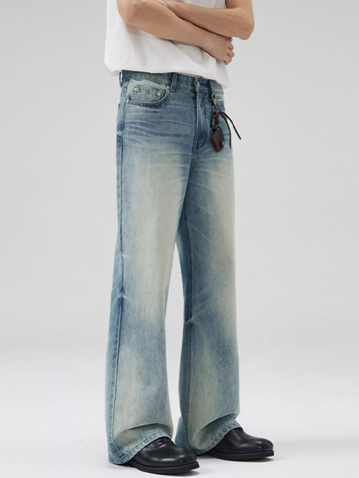 Light blue vintage wash wide-leg cotton jeans with back yoke and patch pockets