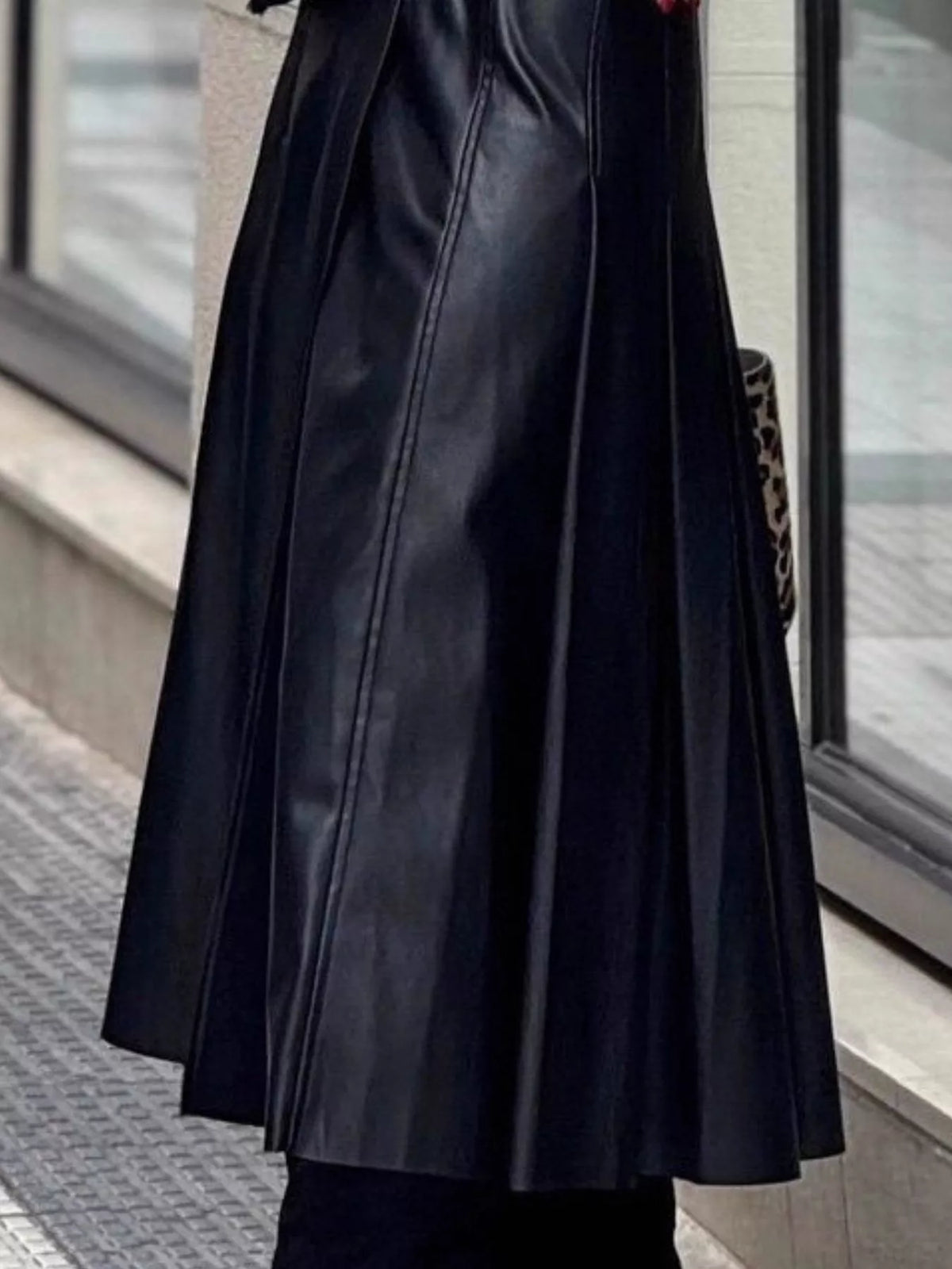 Black vegan leather midi skirt with pleated drape and center front seams