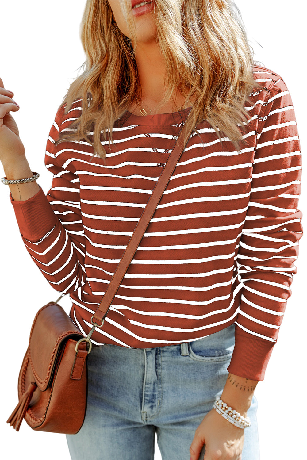 Striped long-sleeve round-neck top, rust red and white horizontal stripes, front view