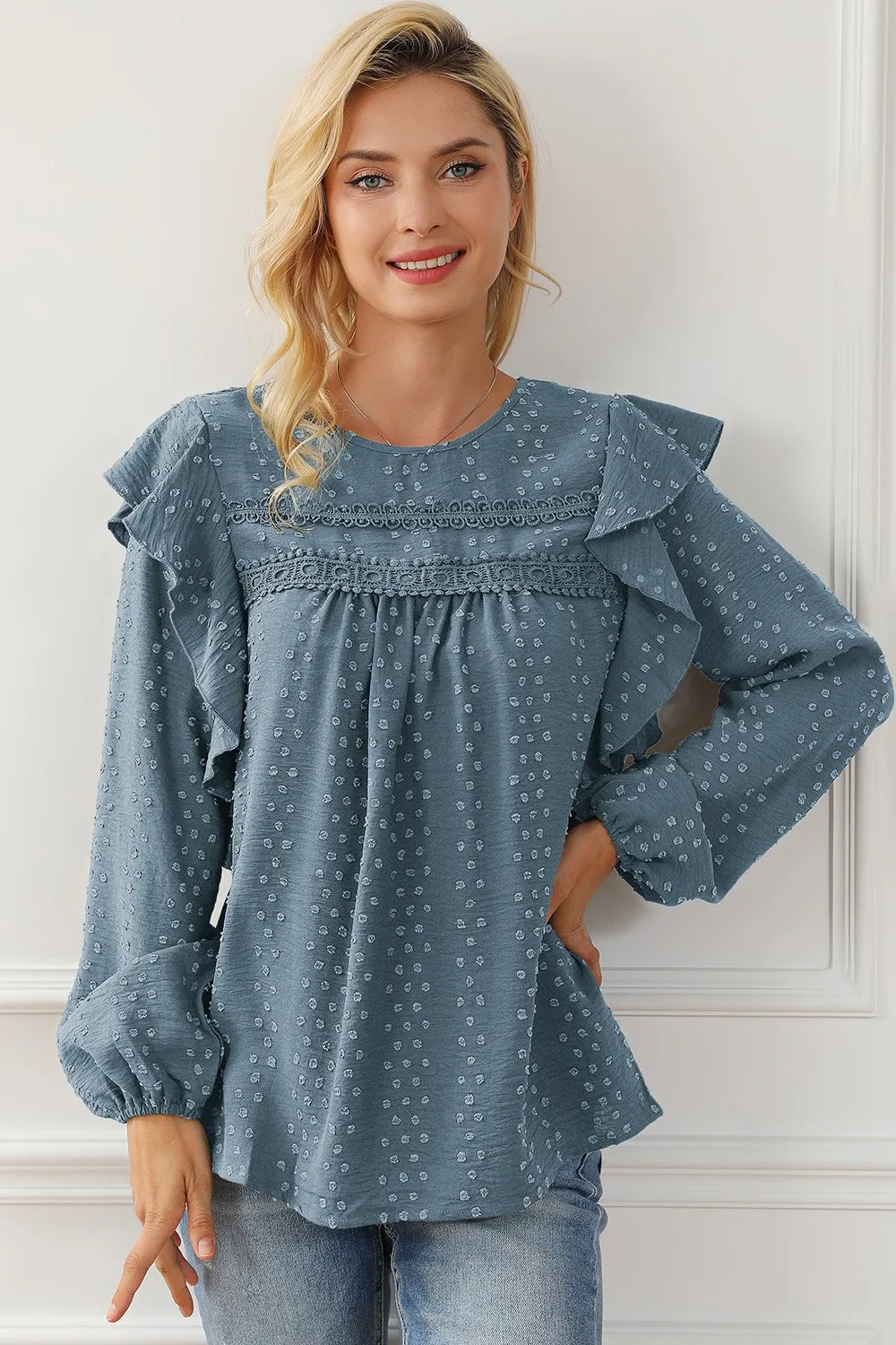 Blue round-neck ruffled blouse with long ruffle sleeves and small dot print