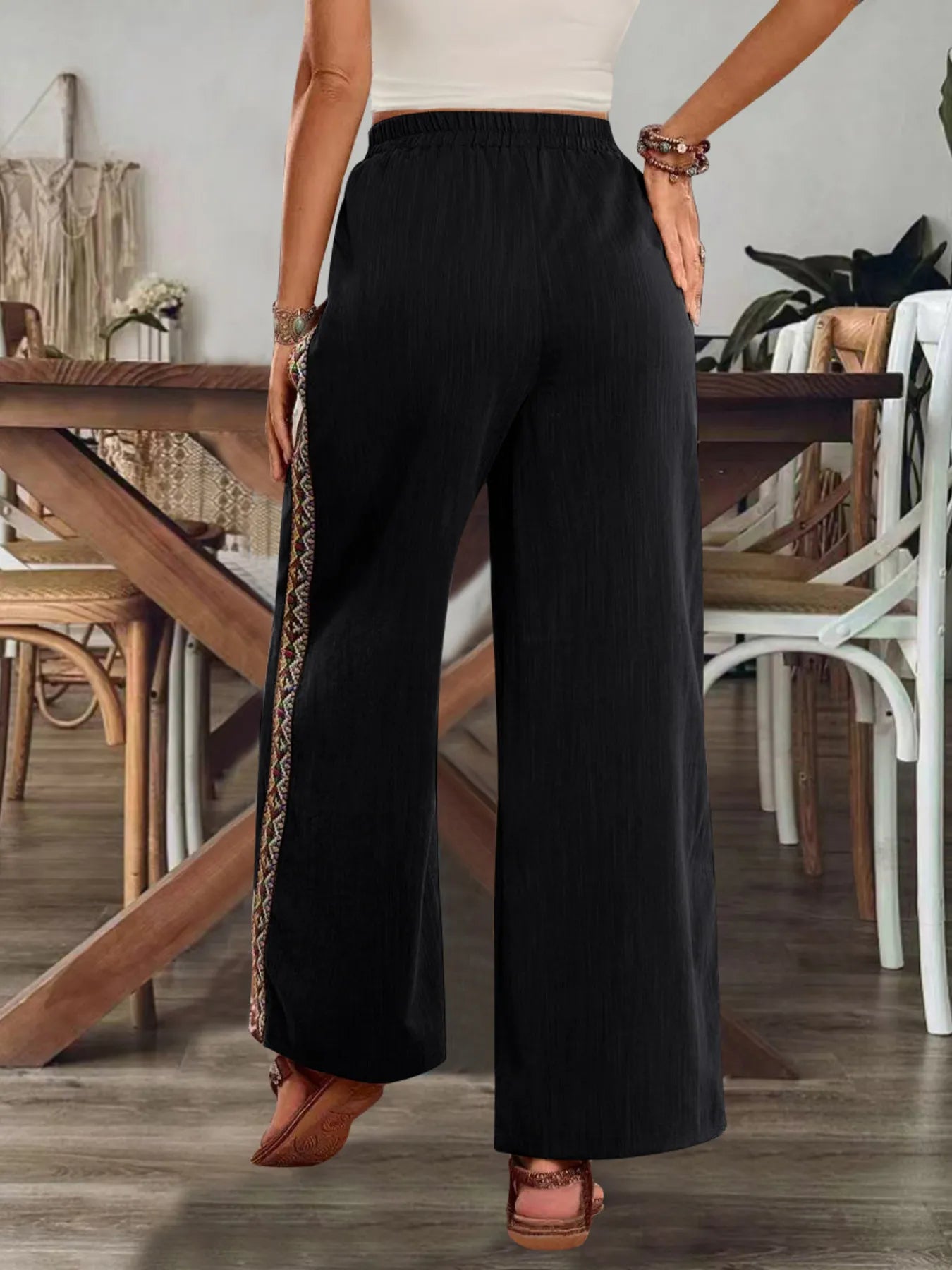 Black wide-leg pants with embroidered side stripe, elastic waist, ankle length