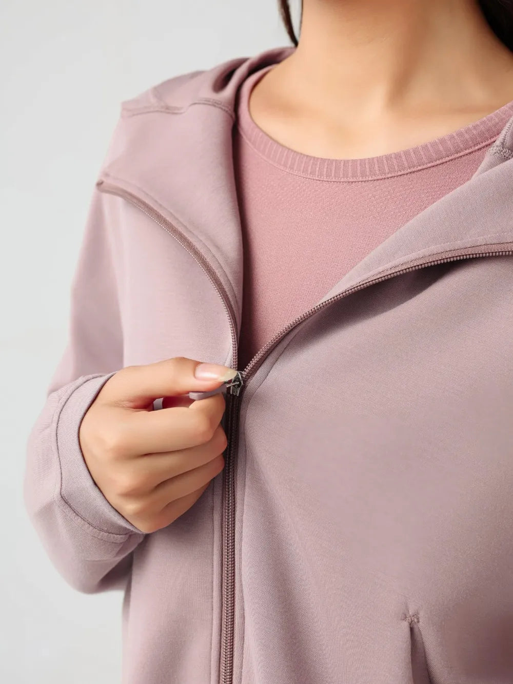 Dusty pink zip-up active hoodie close-up with full zipper and hood edge seam detail