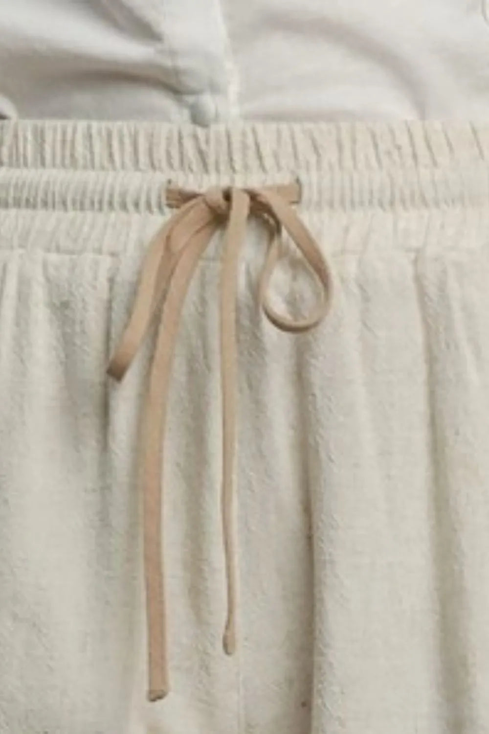 Oatmeal drawstring waist shorts with elastic waistband and scalloped hem