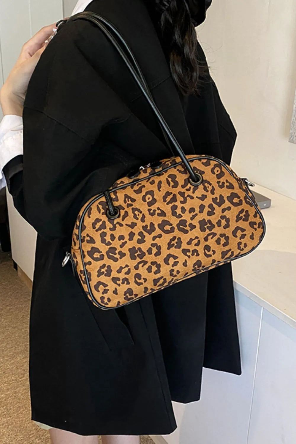 Caramel leopard suede medium shoulder bag with black strap and rounded top