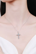 Silver cross pendant necklace with pavé-style stones on the cross