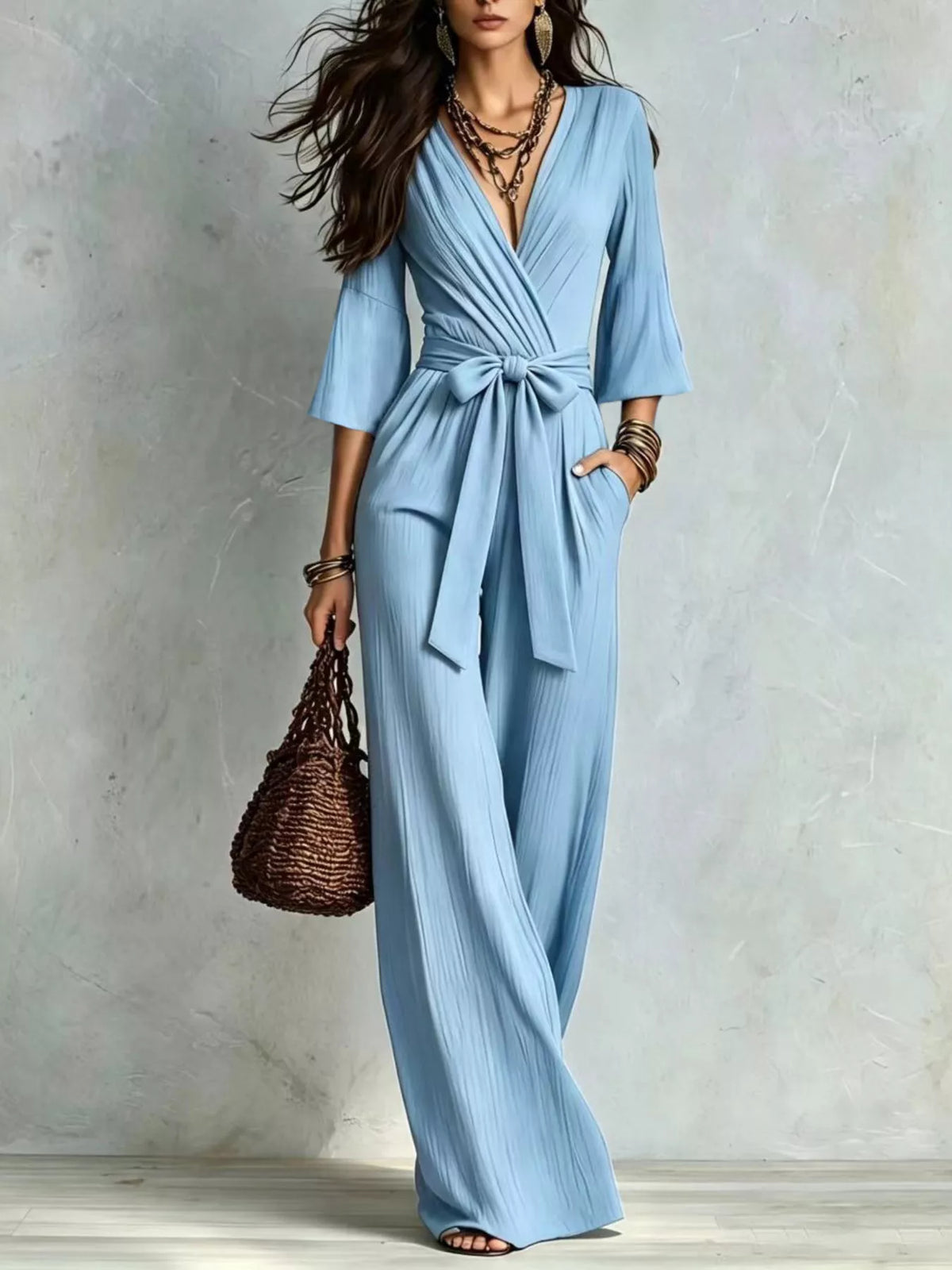 Sky blue pleated tie-waist wide-leg jumpsuit with V-neck and draped bodice
