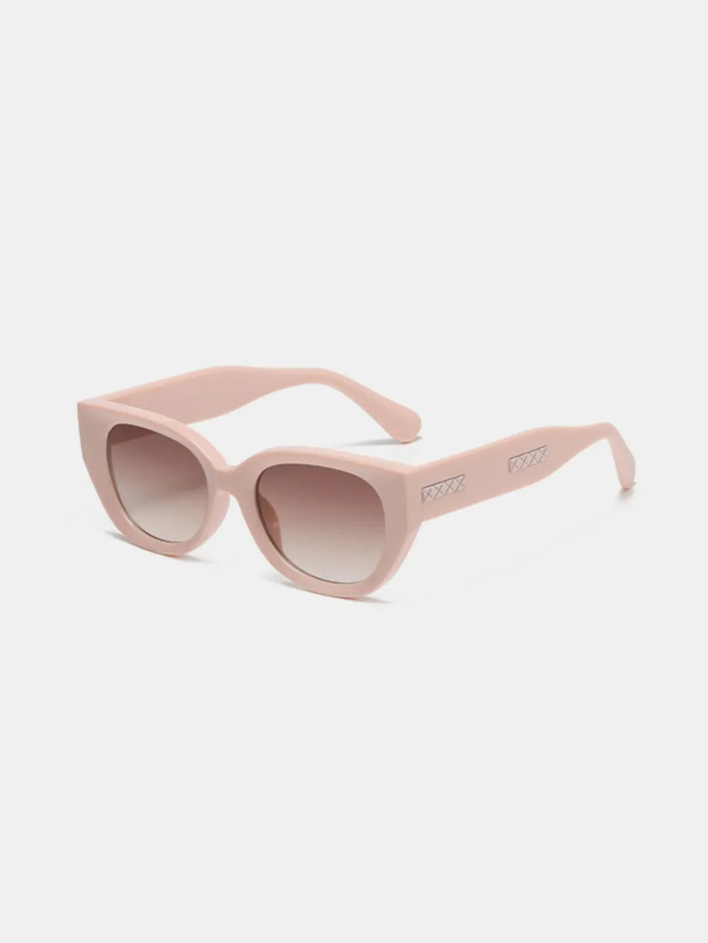 Blush pink cat-eye polycarbonate sunglasses with tinted lenses and slim temples