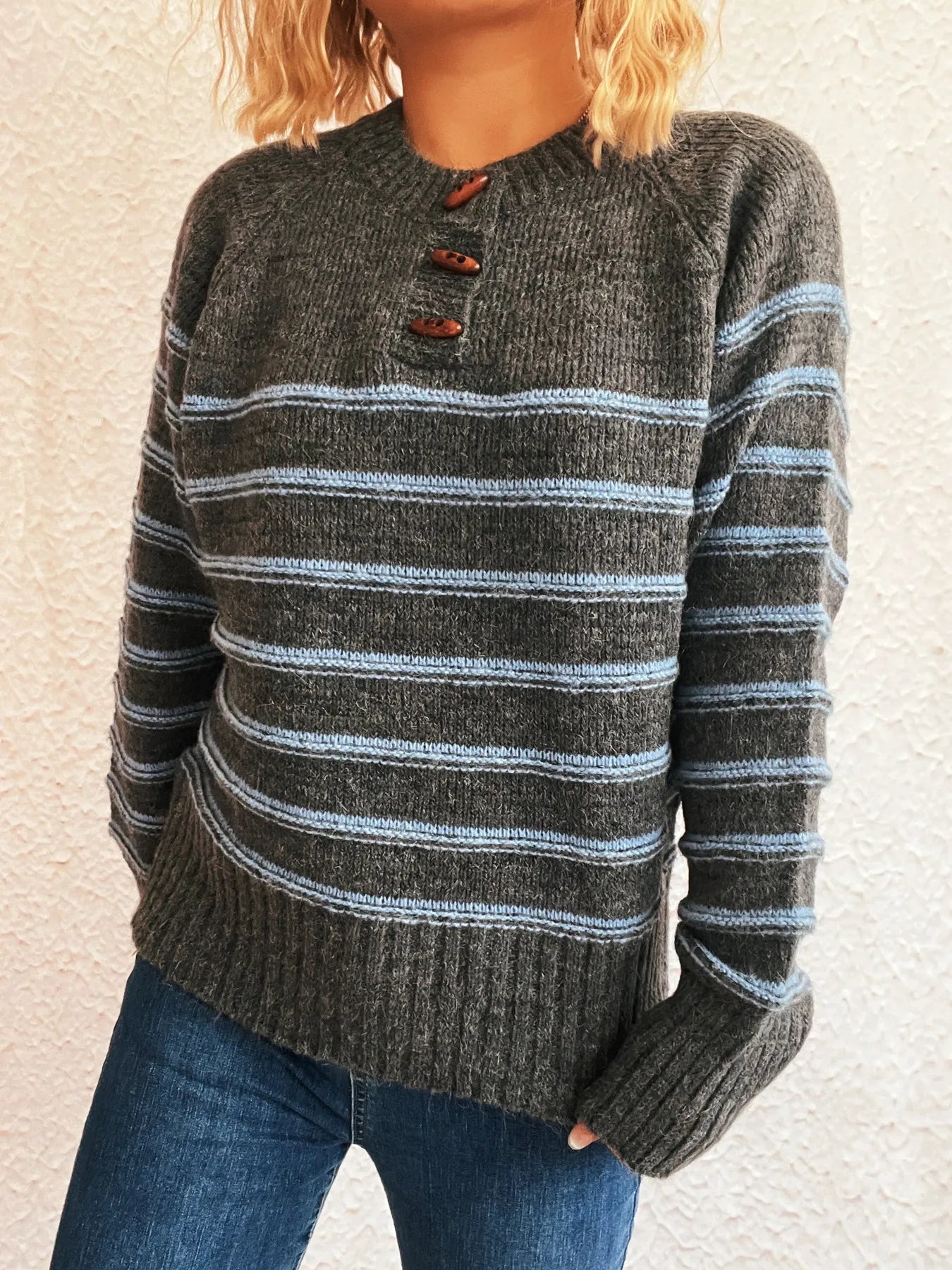 Dark gray striped long sleeve sweater with front button placket and ribbed hem