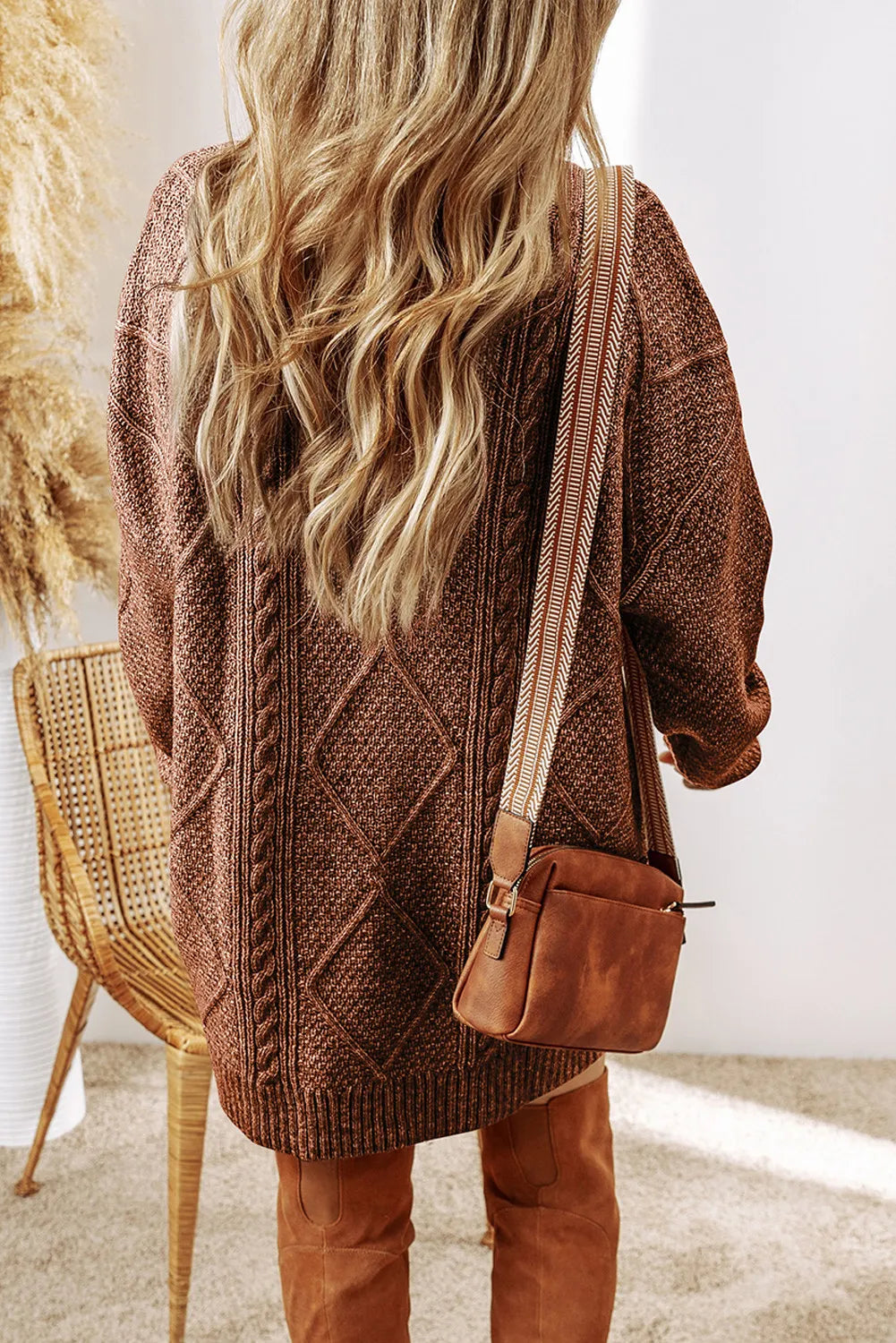 Brown cable-knit round-neck sweater dress with back cable pattern and long sleeves