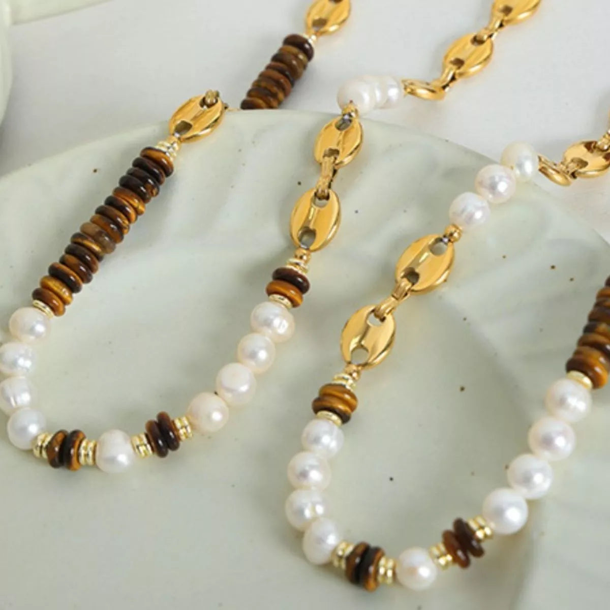 Freshwater pearl and tiger eye bead necklaces with gold link chain