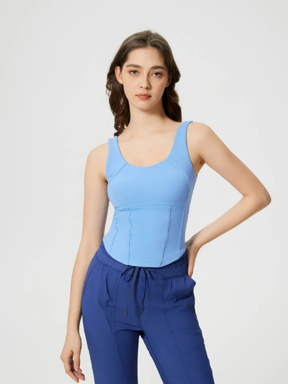 Light blue round-neck active tank with wide straps and stitched bust seams