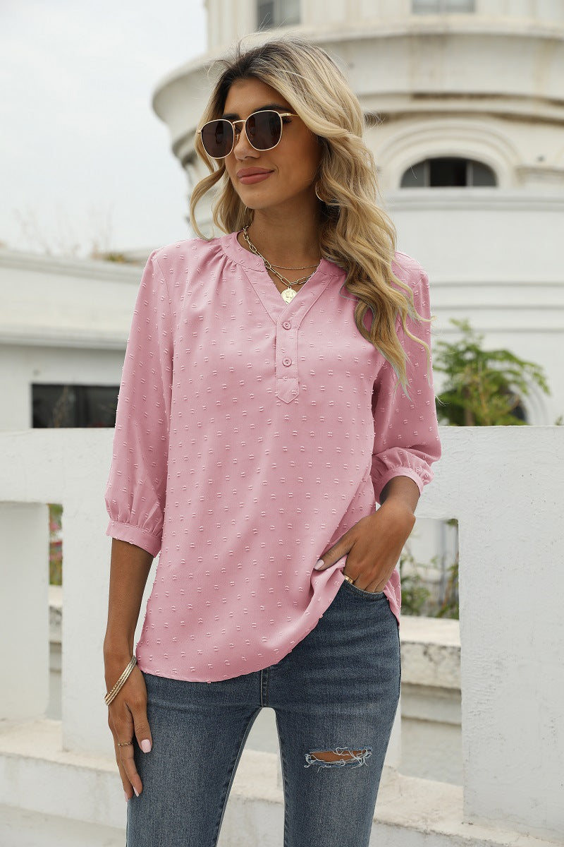 Blush pink Swiss-dot notched-neck blouse with 3/4 puff sleeves and button front