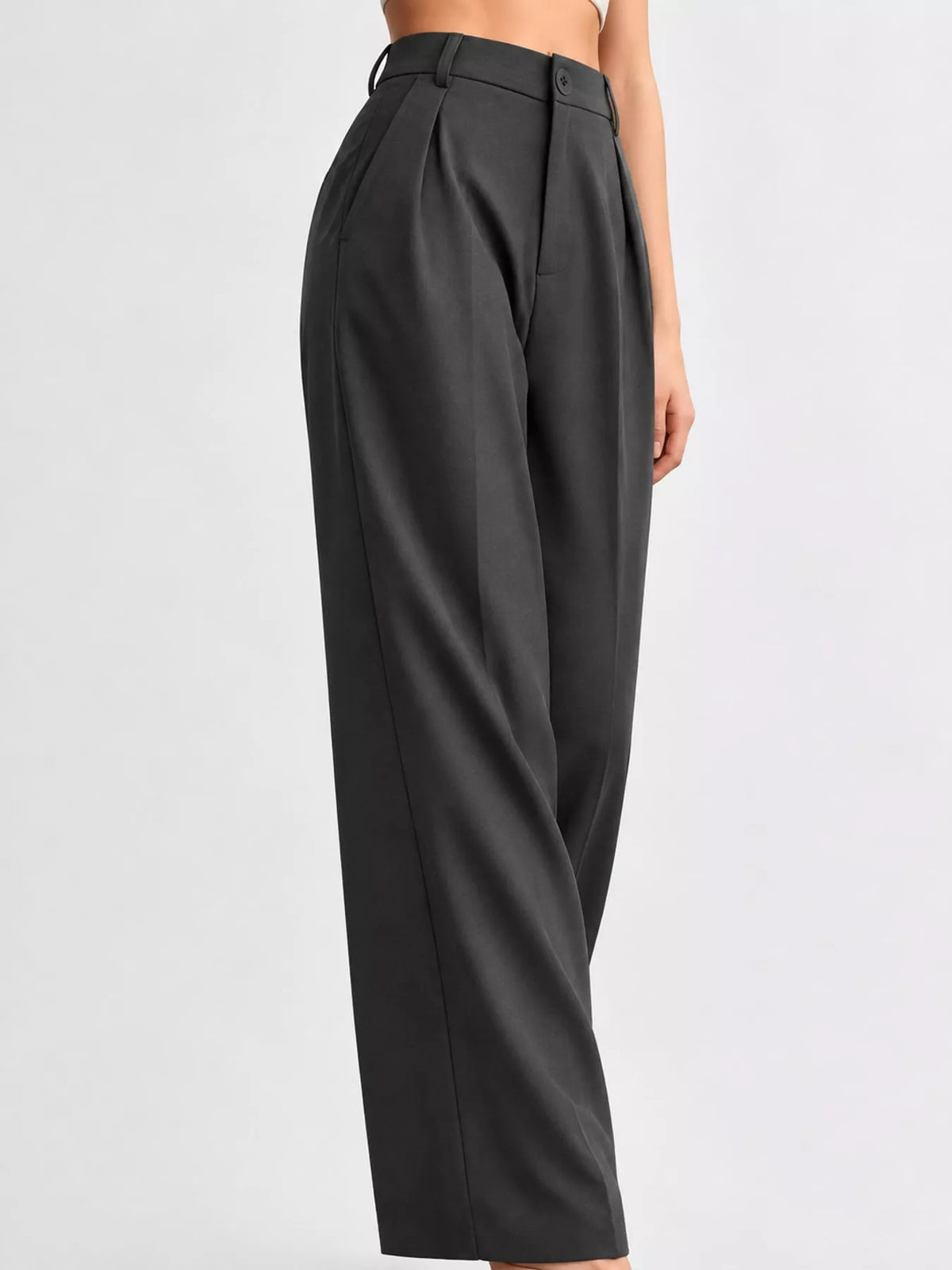 Black high-waisted pleated wide-leg pants with belt loops and buttoned waistline