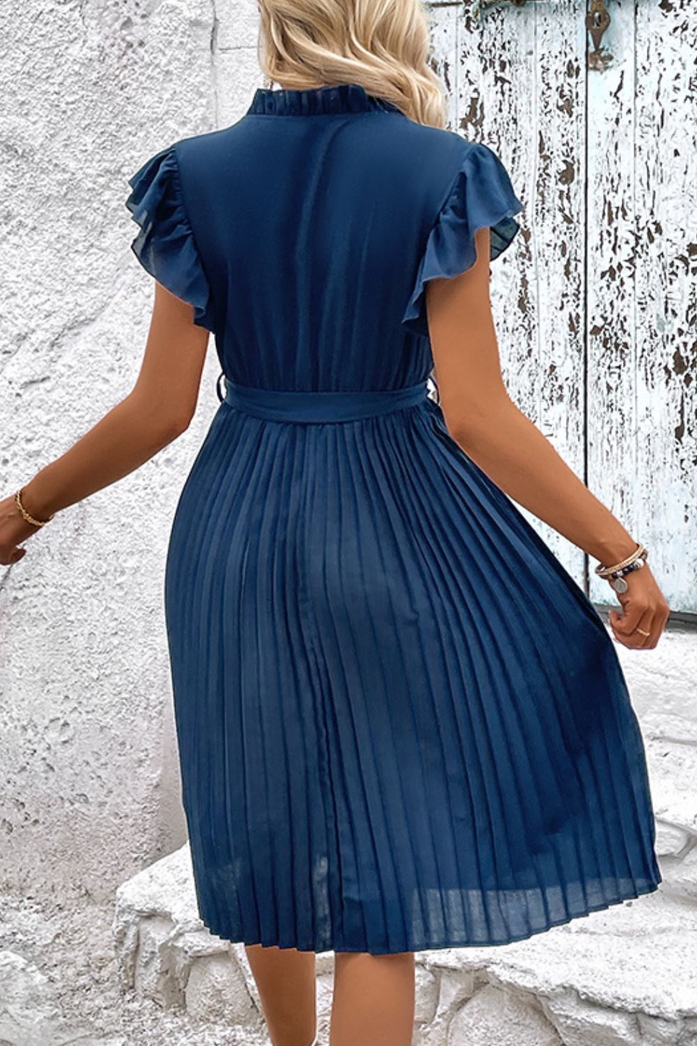 Deep teal pleated midi dress with tied waist and short ruffled sleeves