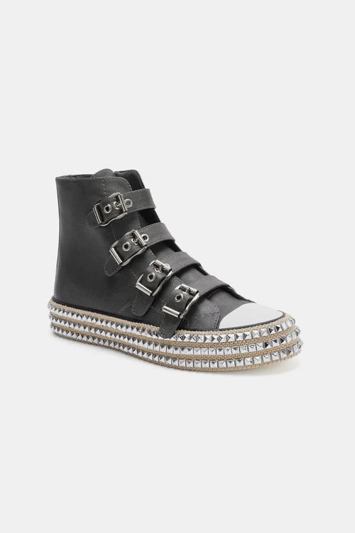 Black high-top platform sneakers, three buckle straps, studded rim and white toe