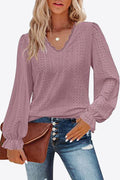 Lavender eyelet V-neck blouse with flounce cuffs and long puff sleeves