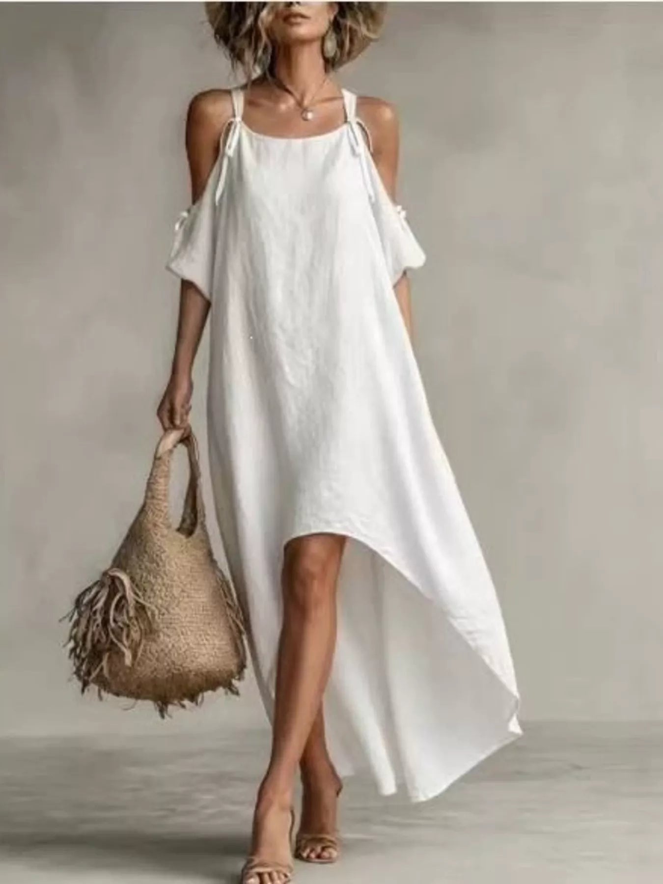 White cold-shoulder high-low maxi dress with tie shoulder cutouts and asymmetrical drape hem