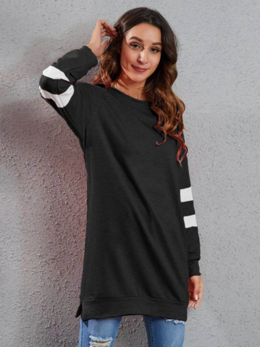 Black long-sleeve T-shirt with round neck and white striped cuffs and side hem