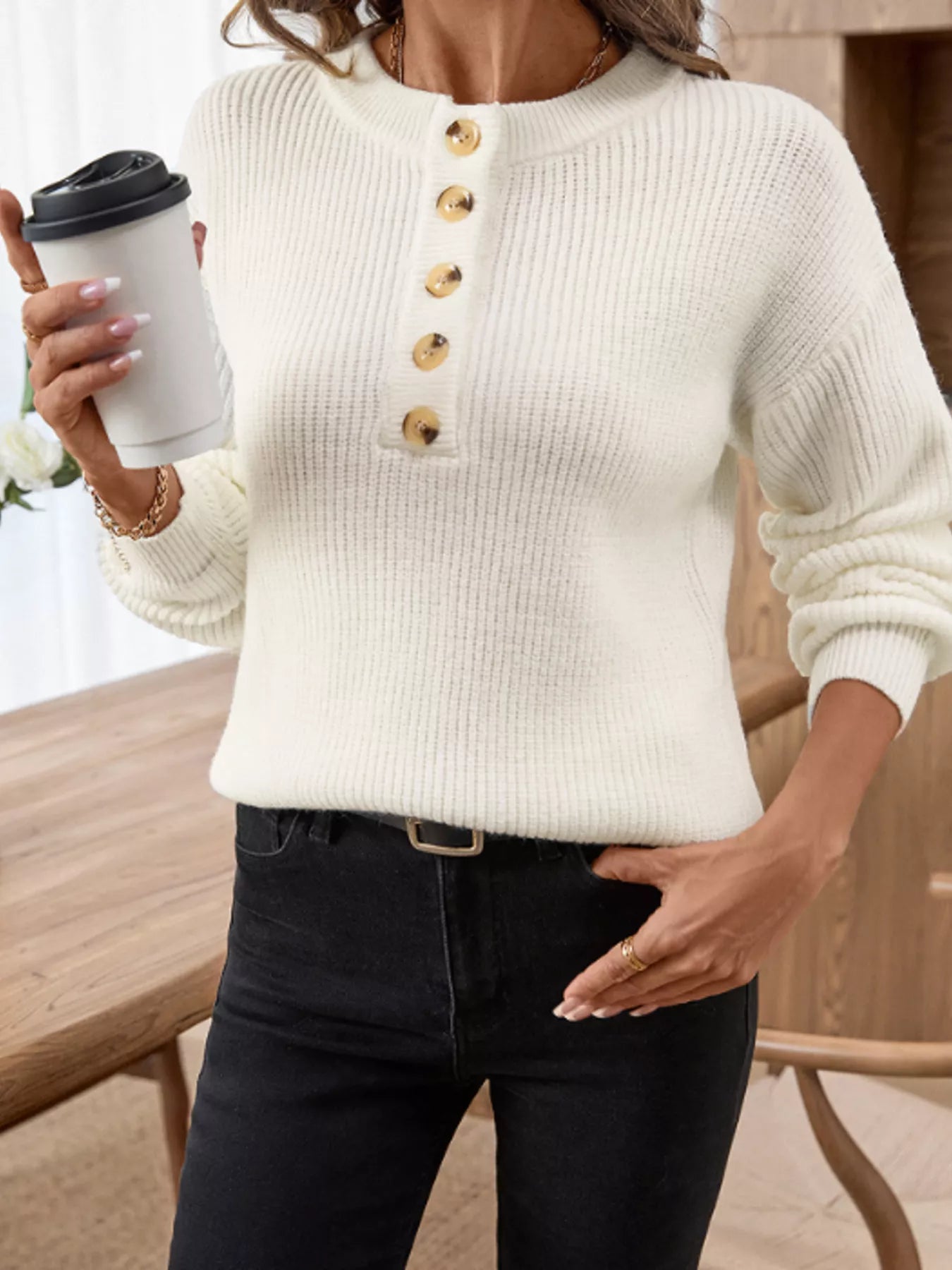 Cream long-sleeve henley sweater with gold-toned buttons and ribbed cuffs
