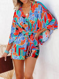 Floral printed romper with V-neck, elastic waist, and loose long sleeves