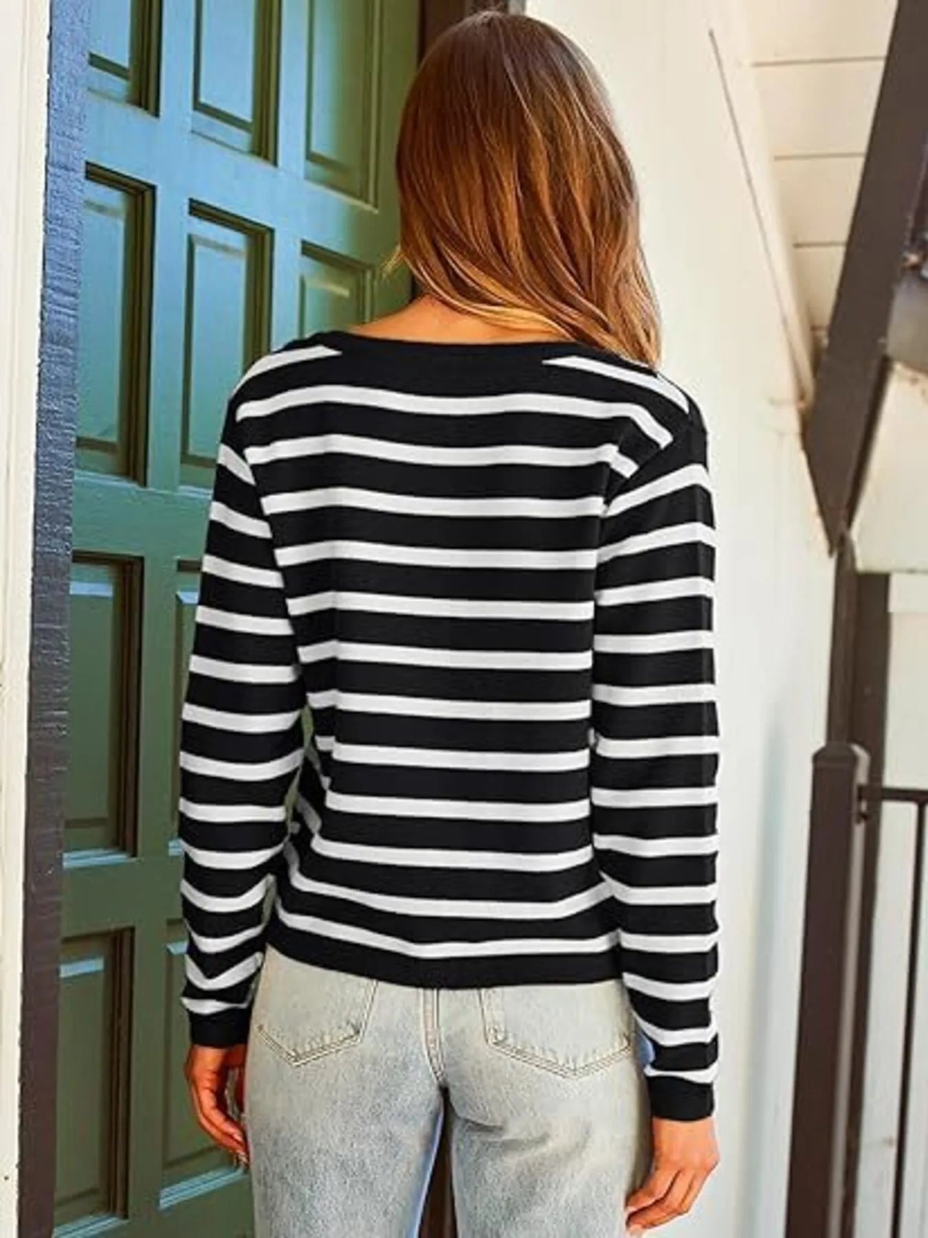 Black and white striped cardigan from the back with long sleeves