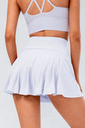 High waist pleated active skirt in white, pleated panels and swing hem