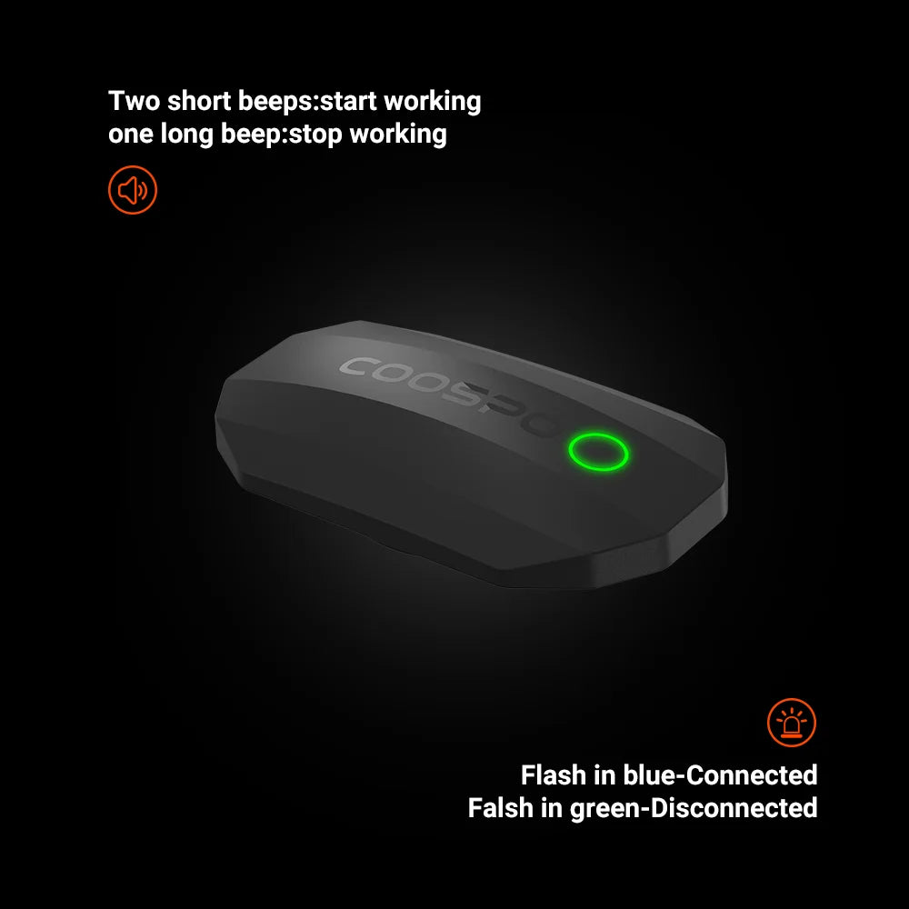 Gray heart rate monitor sensor pod with green LED ring on black background