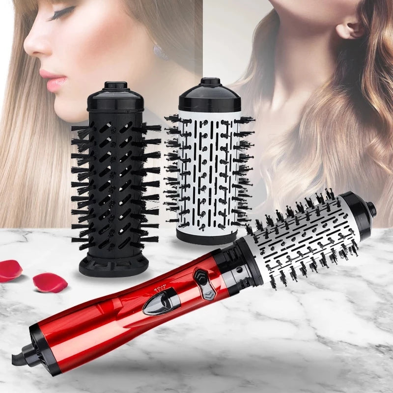 Red hair dryer brush with two interchangeable barrel brush heads on countertop