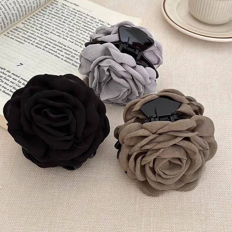3-pack fabric rose hair claw clips: black, gray, and beige on metal pin bars